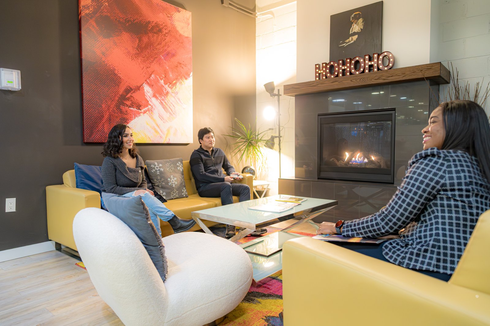 Casual meeting at a holiday party in the fireplace lounge.
