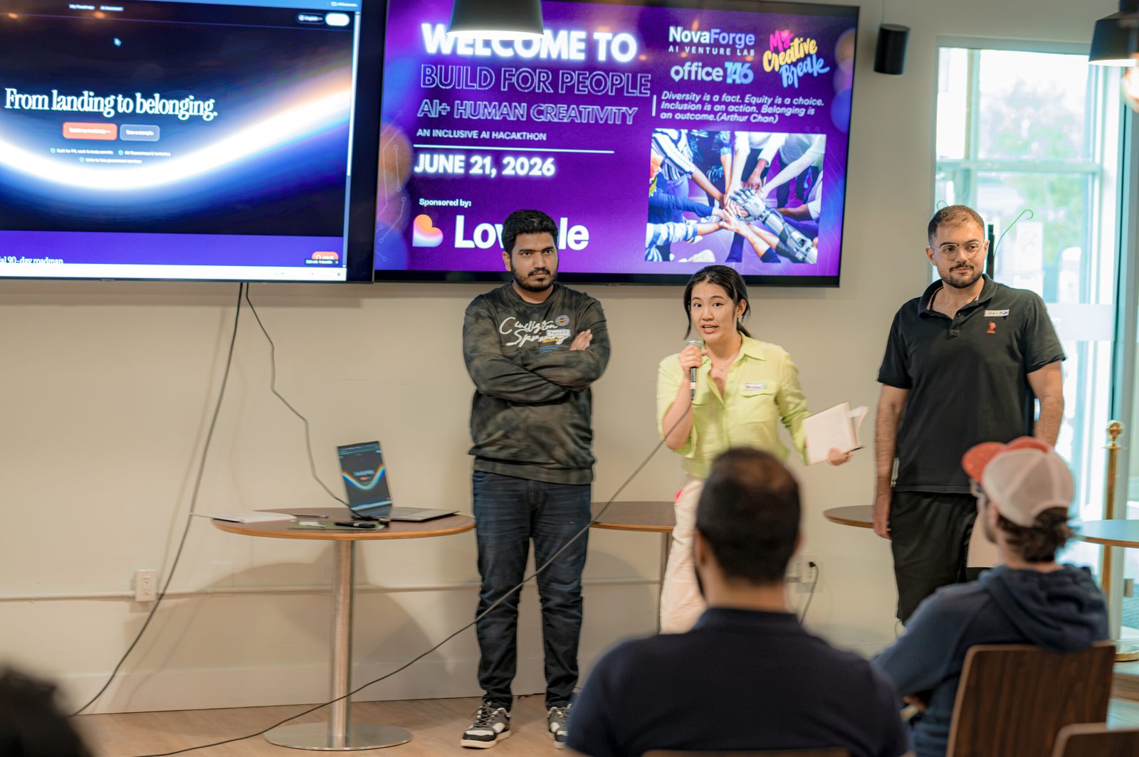 Three presenters explaining their hackathon project.
