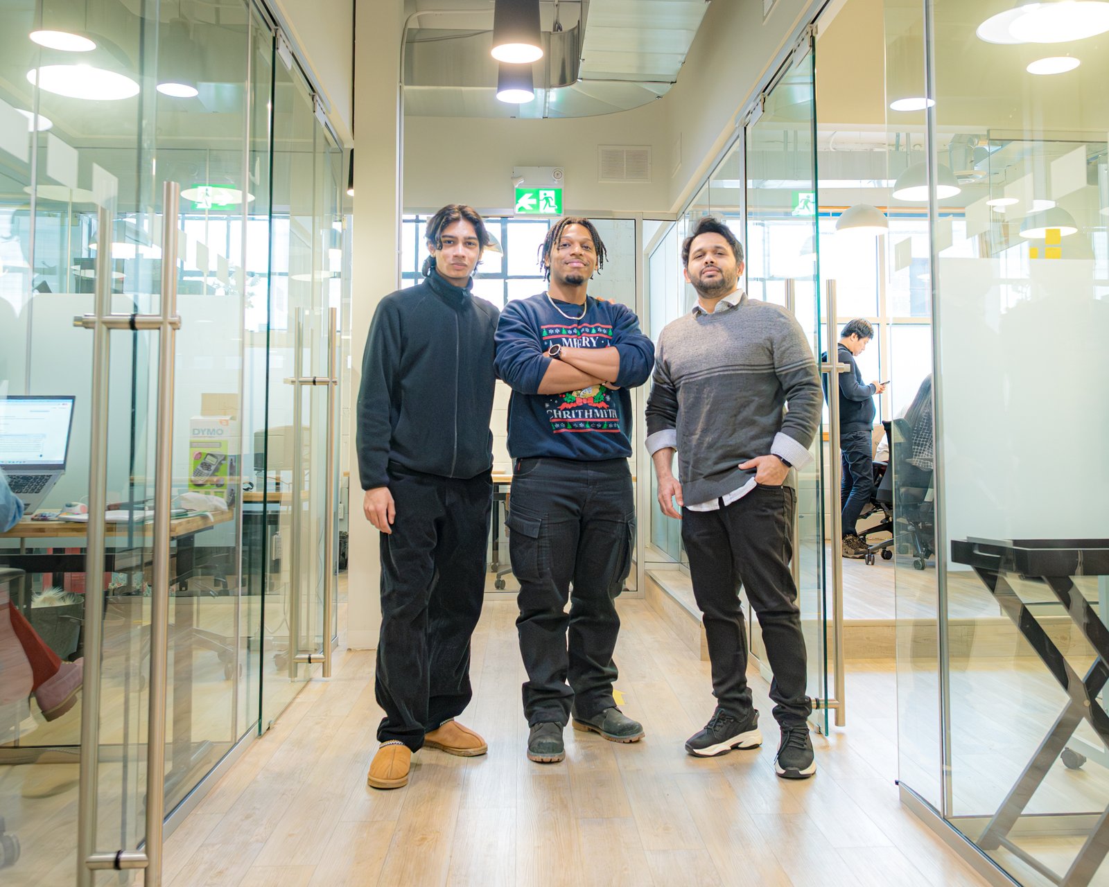 DSC_3433 Three NovaForge employees standing together.